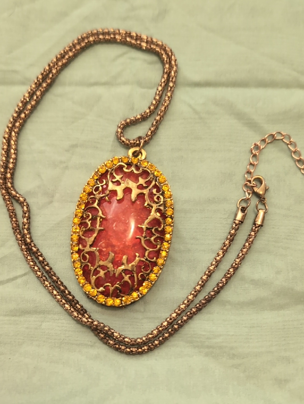 Gold-Tone Oval Pendant Necklace with Orange Crystal Accent And Yellow Rhinestons